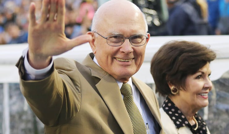 Elder Dallin Oaks of the Quorum of the Twelve Apostles, walking with his wife, Sister Kristen Oaks, waves to the youth participating at BYU's football stadium in conjunction with the Payson Utah Temple dedication in Provo, Utah, Saturday, June 6, 2015.