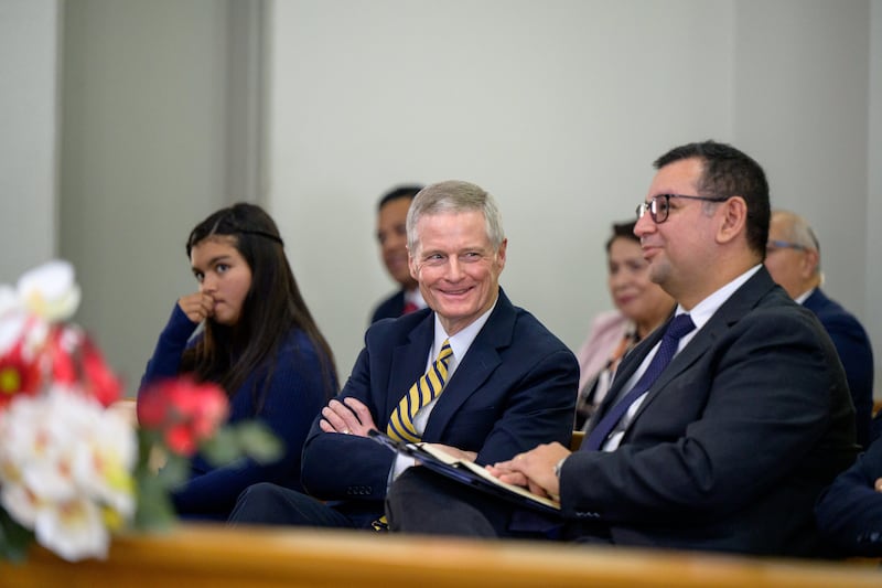 Elder David A. Bednar of the Quorum of the Twelve Apostles, center, smiles during the Colina Chile Stake conference in Santiago, Chile, on May 17, 2026.