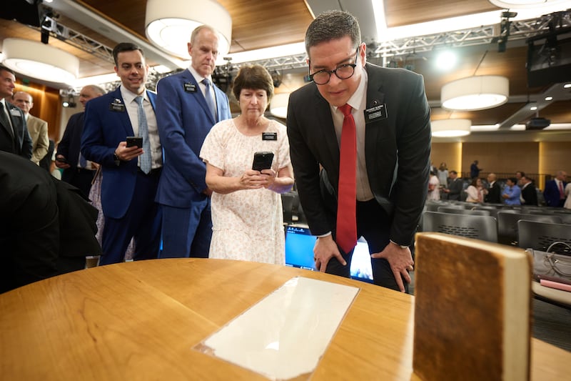 New mission leaders line up to see and photograph an 1830 first edition copy of the Book of Mormon and a page of the original manuscript at the 2026 Seminar for New Mission Leaders at the Provo Missionary Training Center in Provo, Utah, on Friday, June 19, 2026.