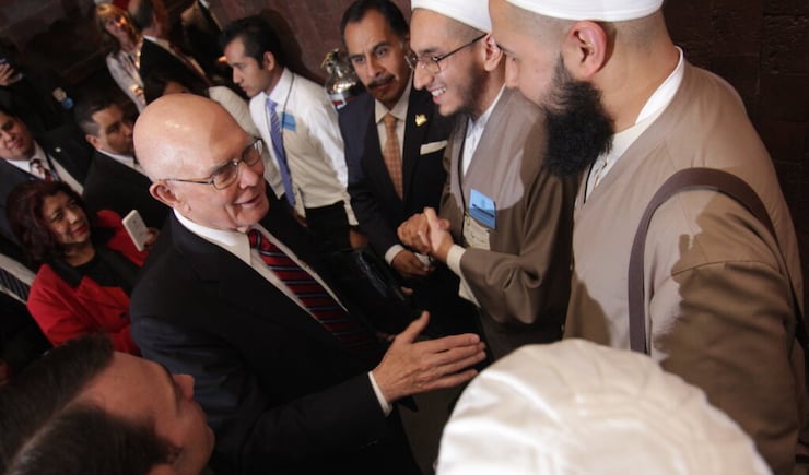 Elder Dallin H. Oaks greets participants at J. Reuben Clark Law Society in Mexico City. Elder Oaks spoke on protecting religious liberties.