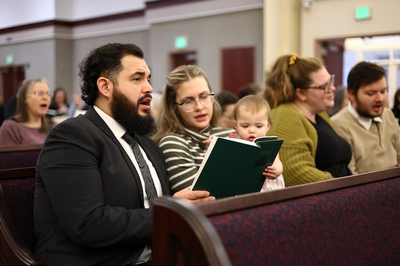 Members of The Church of Jesus Christ of Latter-day Saints sing hymns as part of worship.
