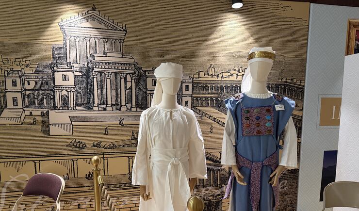 Before entering the tabernacle replica, visitors can see depictions of clothing temple workers and priests would have worn in the Old Testament, Farmington Utah North Stake center, June 18, 2026.