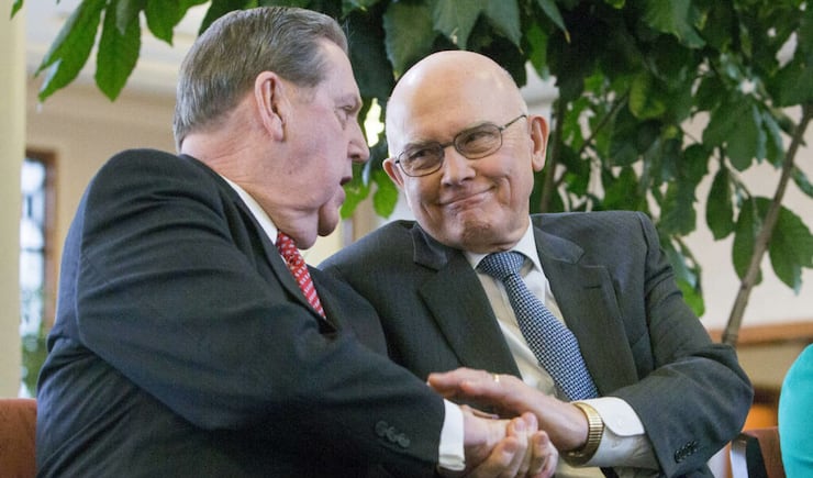 Elder Jeffrey R. Holland of the Quorum of the Twelve Apostles of The Church of Jesus Christ of Latter-day Saints, and Elder Dallin H. Oaks, of the Quorum of the Twelve Apostles, shake hands inside the Conference Center in Salt Lake City after a news conference on Tuesday, Jan. 27, 2015, where church leaders reemphasized support for LGBT nondiscrimination laws that protect religious freedoms.